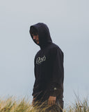 Rbbsh Core Rbbsh Hoodie in faded black, showcasing a casual hooded sweatshirt with a front pocket and adjustable drawstrings.