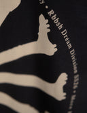 Rbbsh More Feet More Footy Tee displayed on a hanger, featuring a casual graphic T-shirt with sporty design and vibrant colors.
